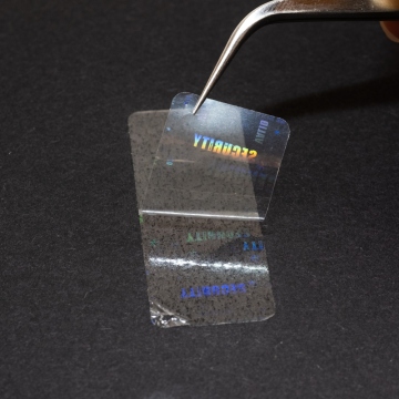 Przezroczysta folia pieczętująca z ukrytym hologramem etykiety 45 x 17 mm