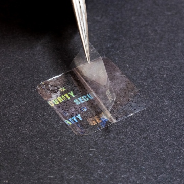 Przezroczysta folia pieczętująca z ukrytym hologramem etykiety 20 x 20 mm
